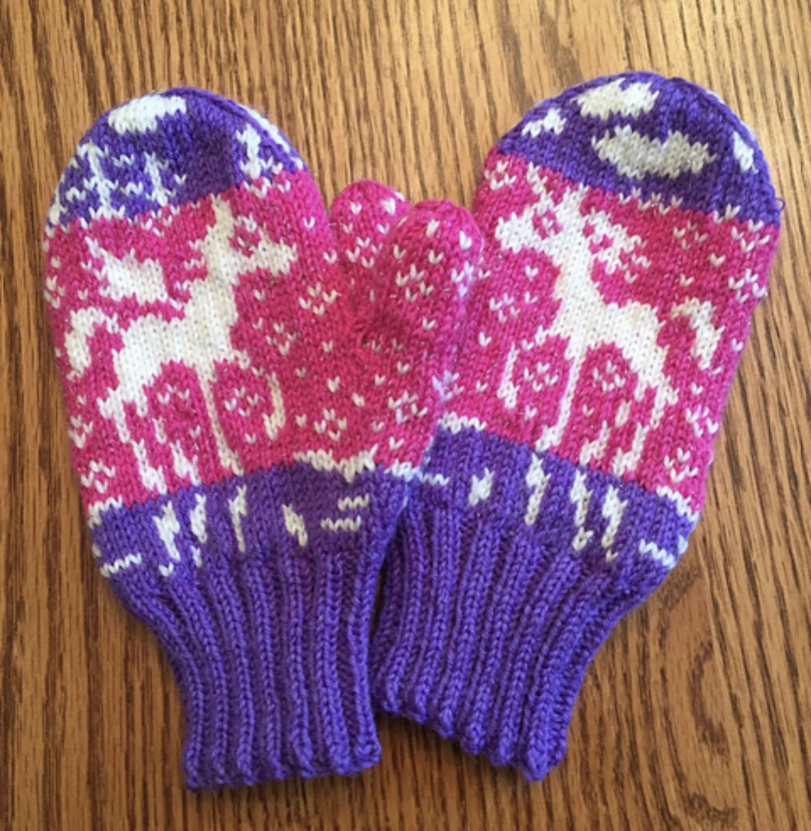 A finished pair of hand-knit patterned mittens