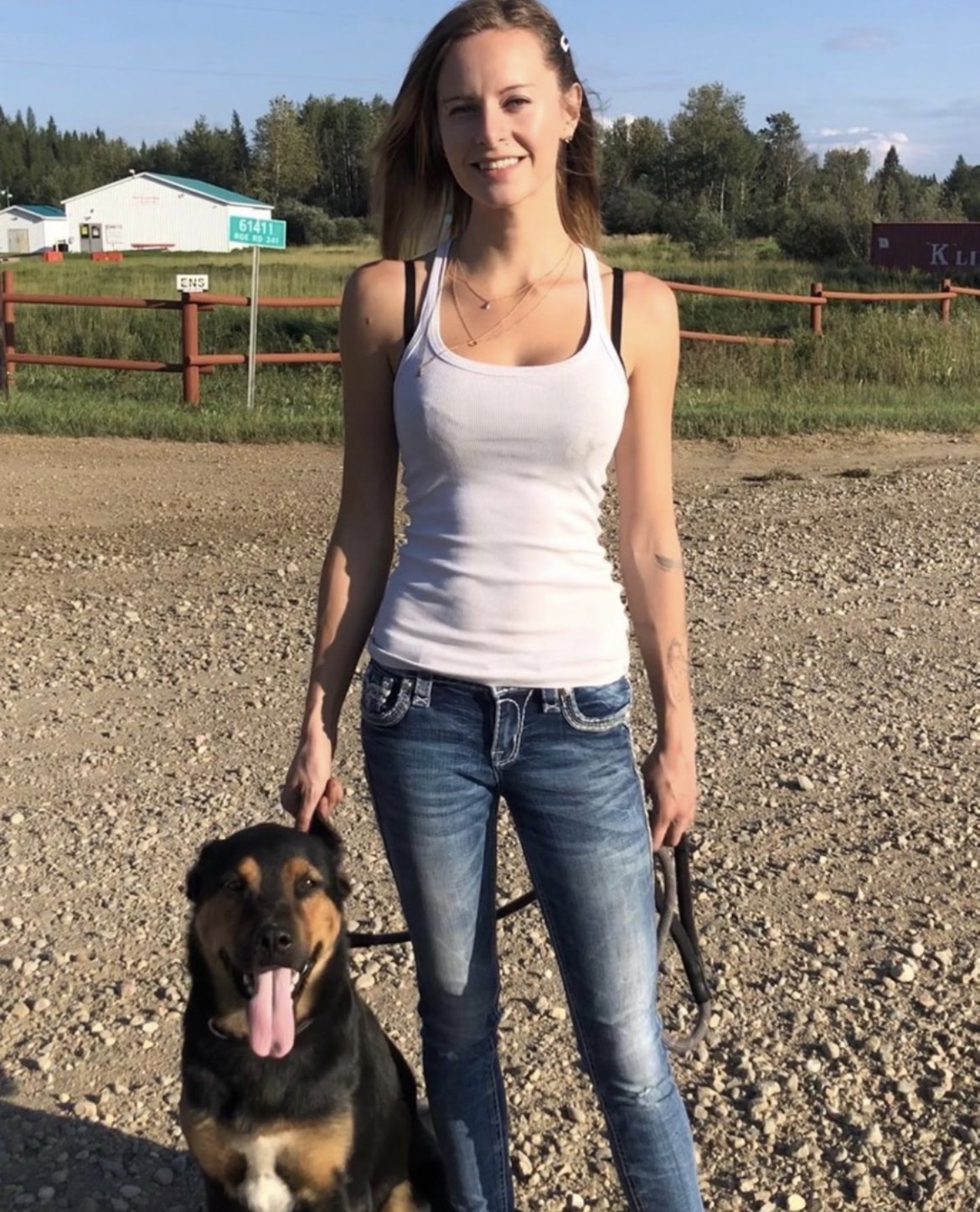 Out on the acreage road with a dog at heel
