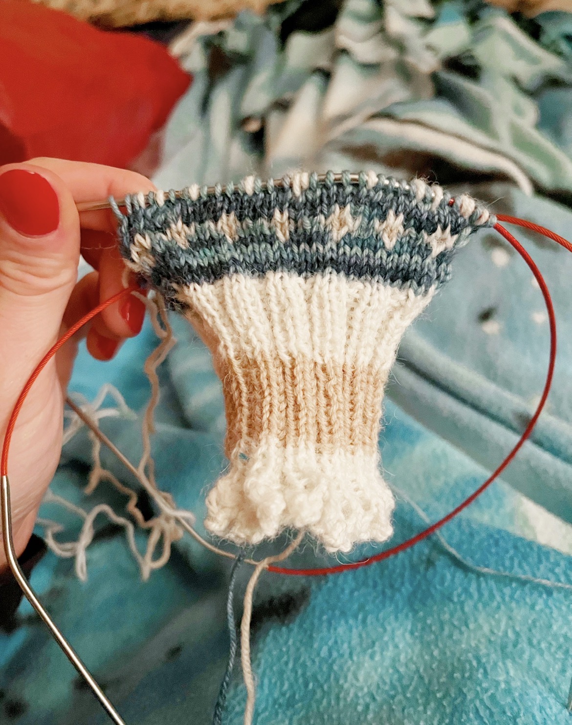 A mitten cuff taking shape on the needles