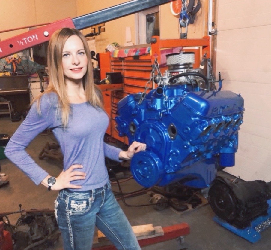 Chantania beside a freshly rebuilt engine on the hoist