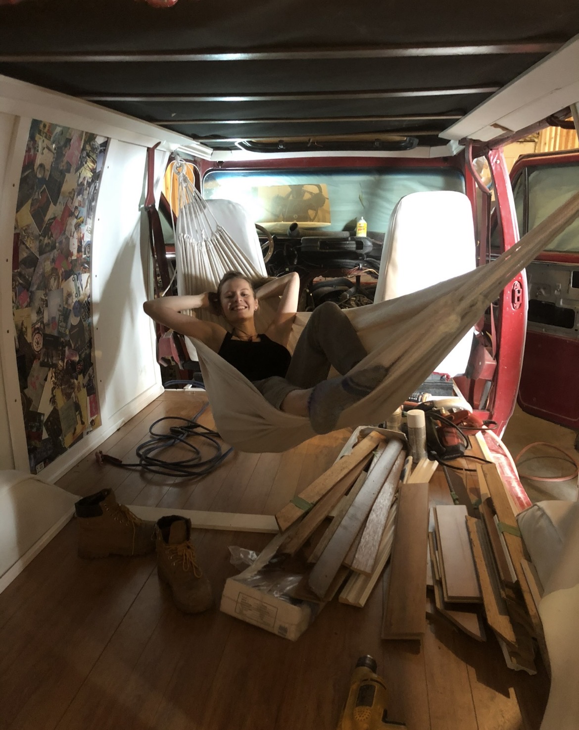 Resting in a hammock mid-build inside a panelled van